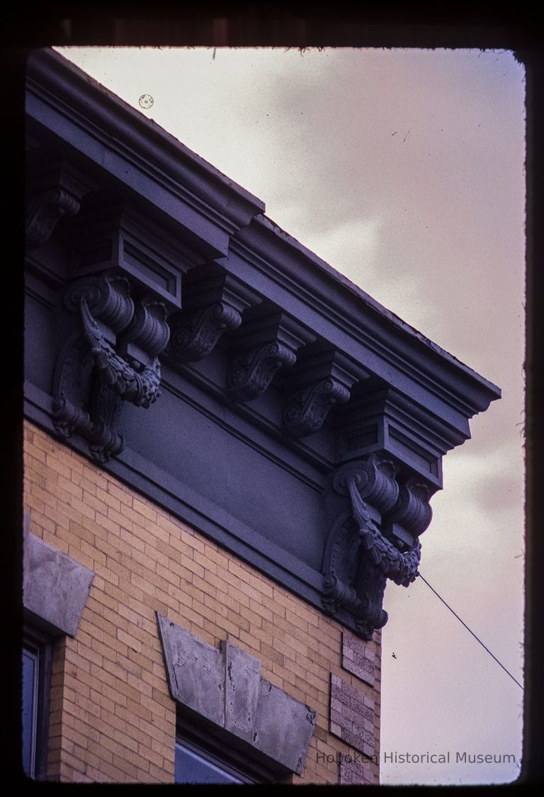 Color slide of detail view of cornice, brackets, frieze and window head at 704 Grand between 7th and 8th picture number 1