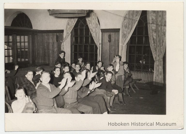 B+W photo of boys on folding auditorium seats for program at Hoboken YMCA, Hoboken, n.d., ca. 1945-1955. picture number 1