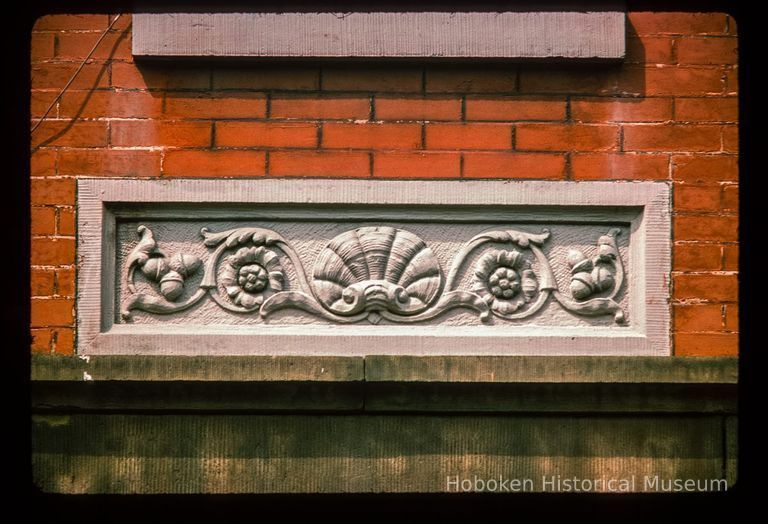 Color slide of close-up view of decorative tile on a building on Bloomfield between 10th and 11th picture number 1