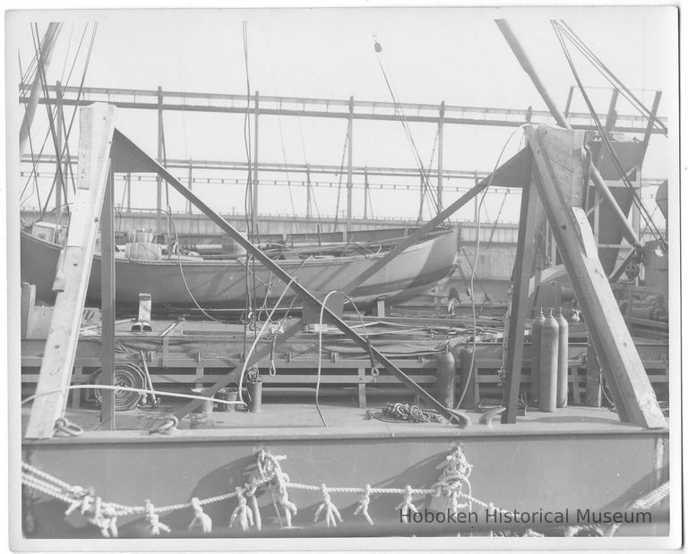 B+W photo of a launch on a deck with repair rigging in foreground, Hoboken, no date, ca. 1940. picture number 1