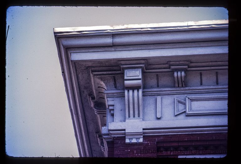 Color slide of detail view of cornice, bracket and frieze at 1321 Washington on the SE corner with 14th picture number 1