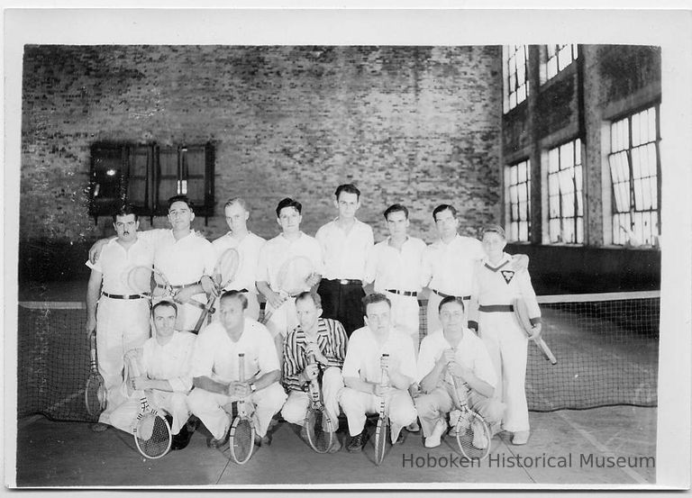 B+W group photo of a tennis team inside a shipyard building, Hoboken, no date, ca. 1930. picture number 1