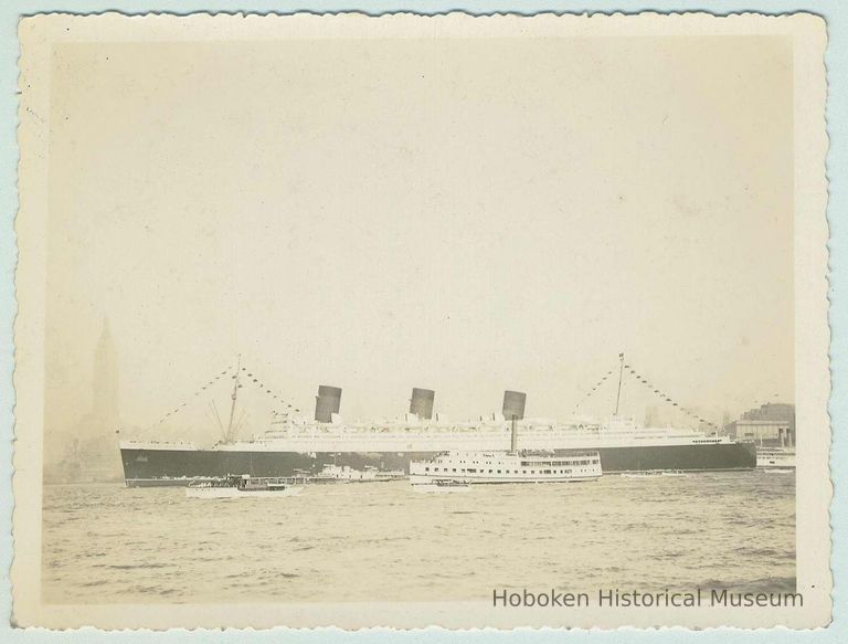 B+W photo of the ocean liner RMS Queen Mary steaming north on the Hudson River, no date, ca. 1938-40. picture number 1