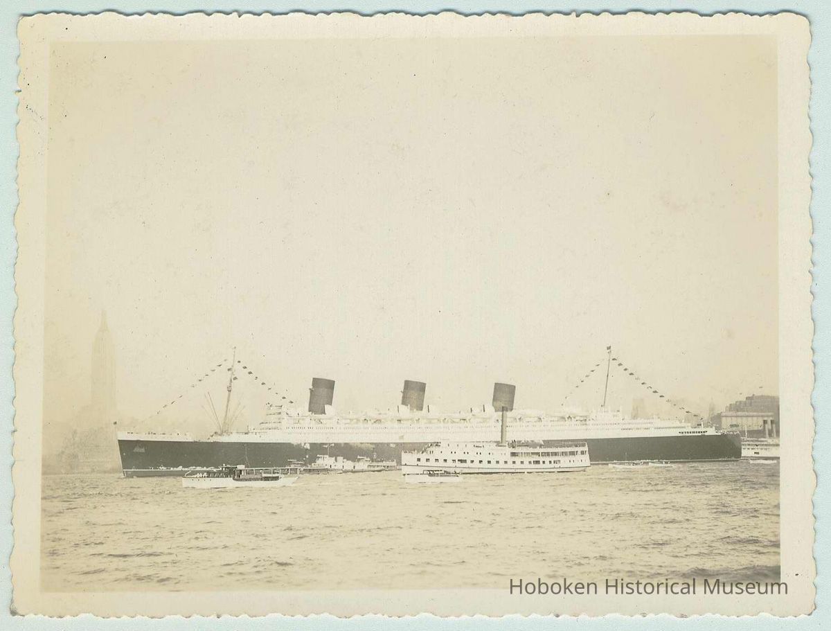 B+W photo of the ocean liner RMS Queen Mary steaming north on the Hudson River, no date, ca. 1938-40. picture number 1