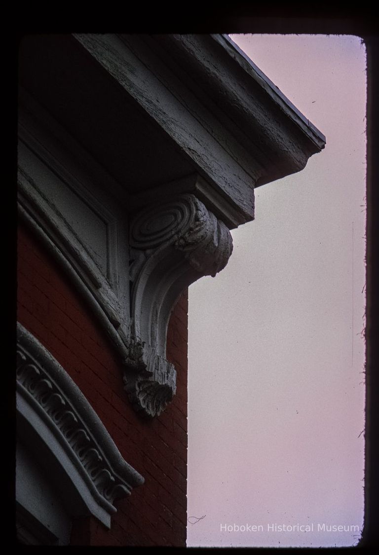 Color slide of detail view of cornice, bracket, frieze and window head at an unidentified building on Washington between 3rd and 4th picture number 1