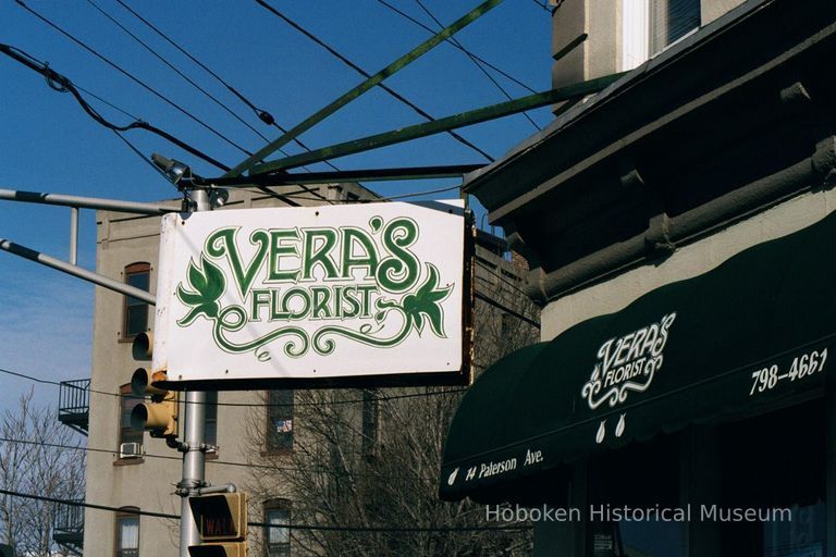 Color photo of hanging sign for Vera's Florist, 15 Patterson Avenue, Hoboken, Jan. 3 & 4, 2002. picture number 1