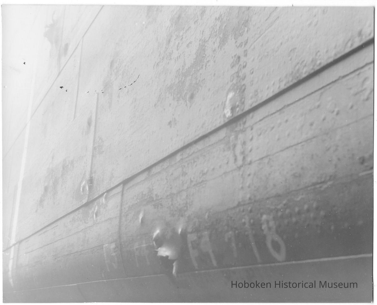 B+W photo of a detail view of hull damage to an unidentified vessel at the Bethlehem Steel Shipyard, Hoboken Division, no date, ca 1940. picture number 1