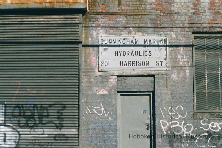 Color photo of wall sign for Cunningham Marine Hydraulics, 201 Harrison Street at 2nd Street, Hoboken, Jan. 3 & 4, 2002. picture number 1