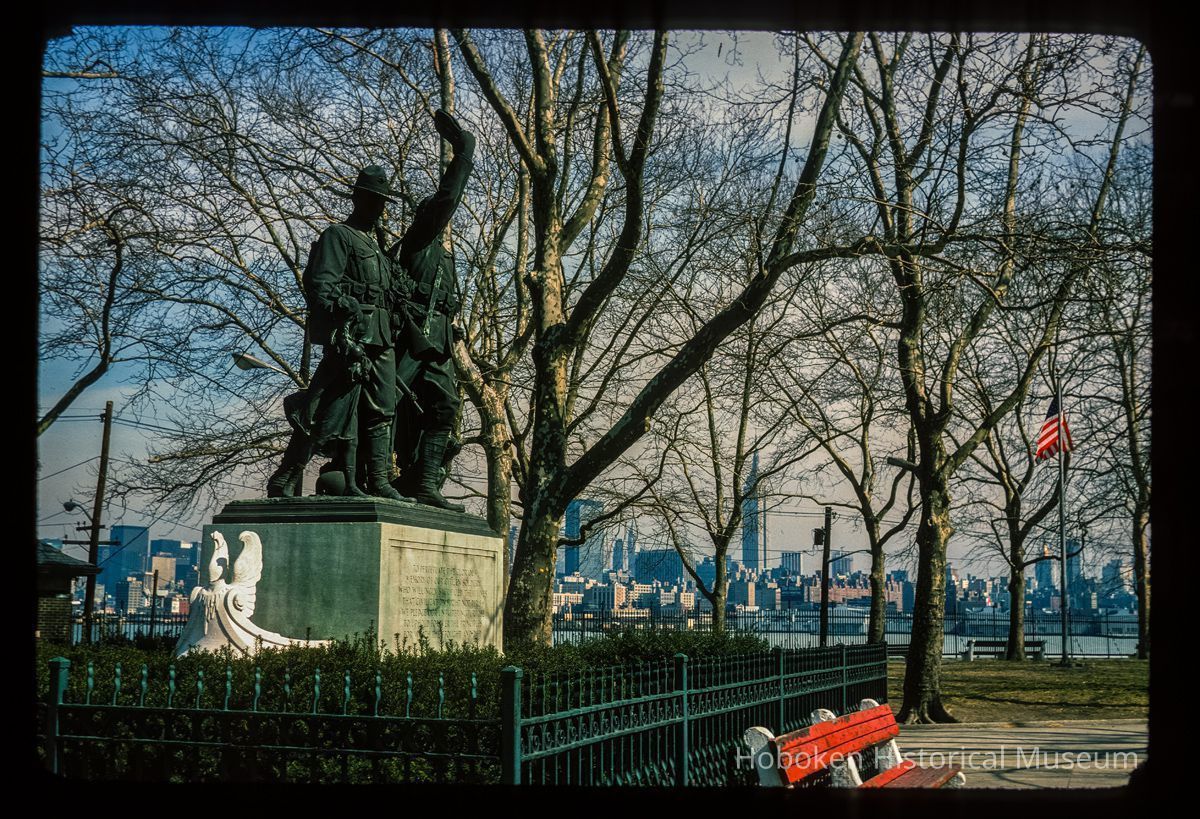 Color slide of eye-level view of The Soldiers' & Sailors' Monument in Elysian Park looking E with the New York City skyline in the background picture number 1