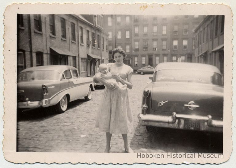 Joan Cunning holding Edward Cunning, Jr. in Willow Terrace South, Hoboken,