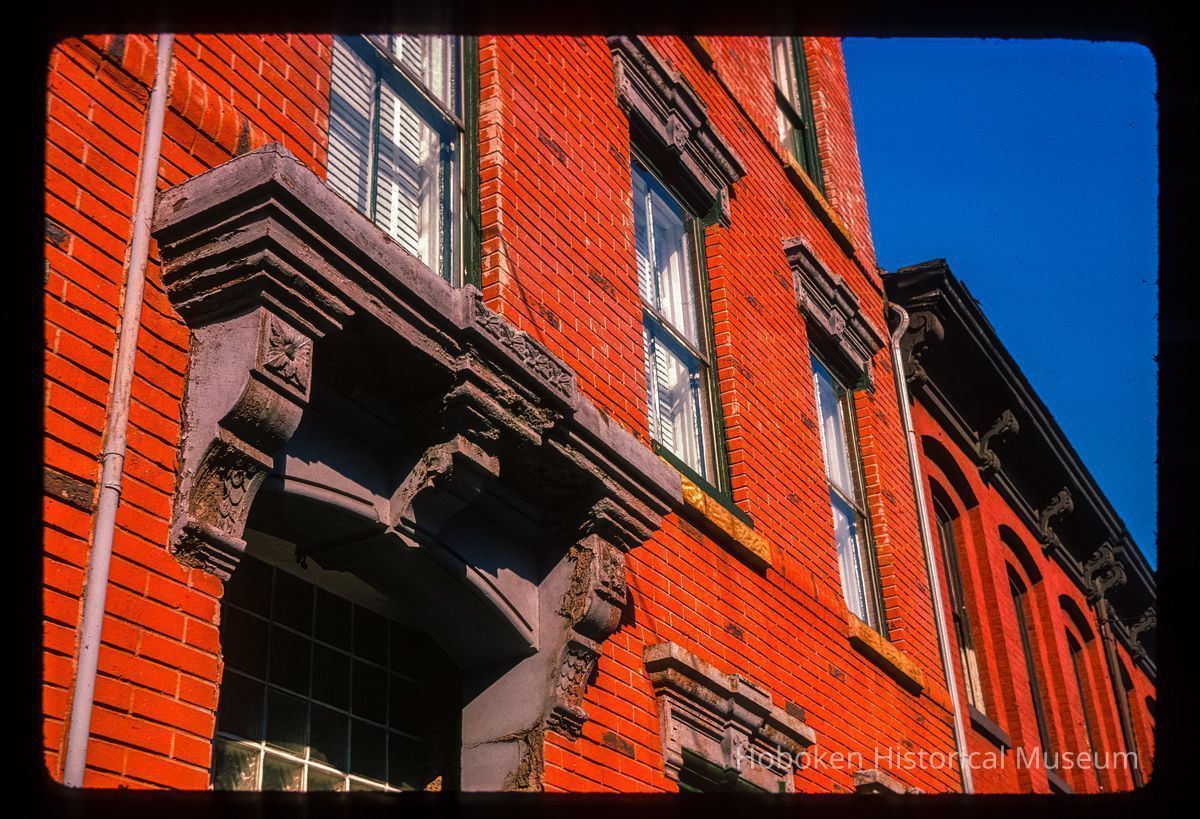 Color slide of detail view of pediments and brackets on a building at an unidentified location picture number 1