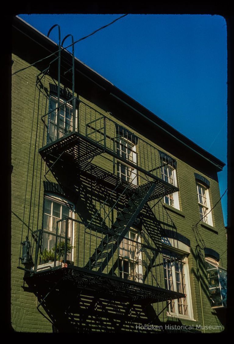 Color slide of detail view of façade and fire escape of building on Court between 4th and 5th picture number 1