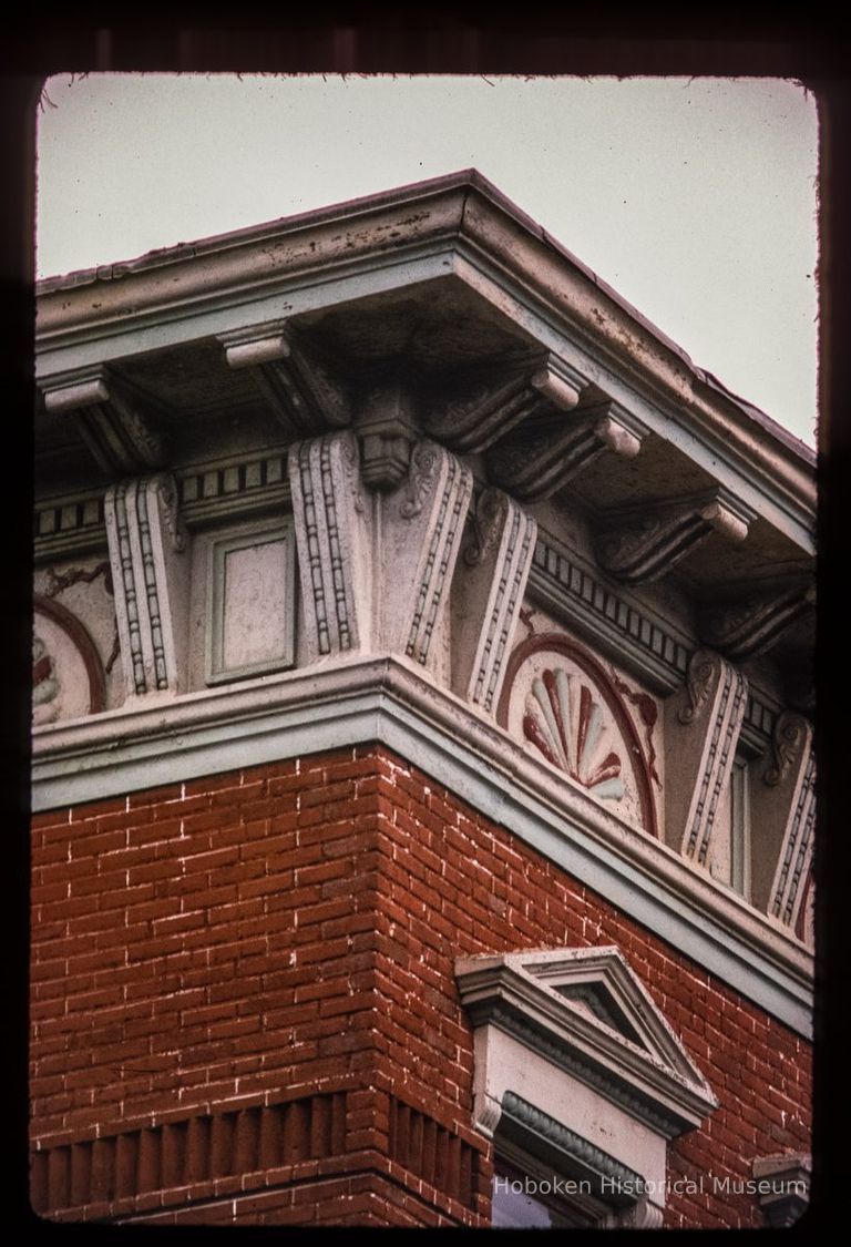 Color slide of detail view of cornice, brackets, dentils, frieze and window head pediment on the corner of Willow and 7th picture number 1