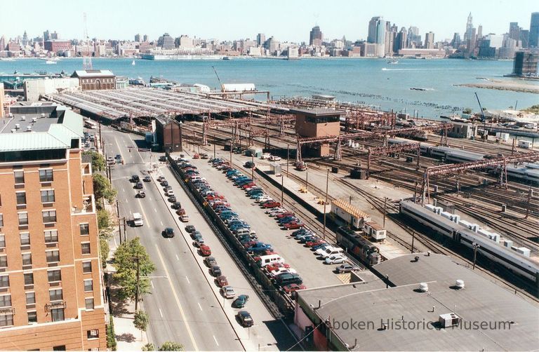 Digital image of color photo of an wider aerial view of the passenger train shed at the Hoboken Terminal, Hoboken, Sept., 2002. picture number 1