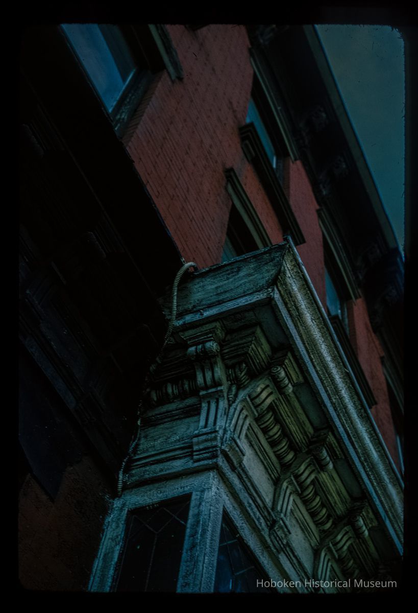 Color slide of detail view of façade, cornice and brackets on a building on Washington between 6th and 7th picture number 1