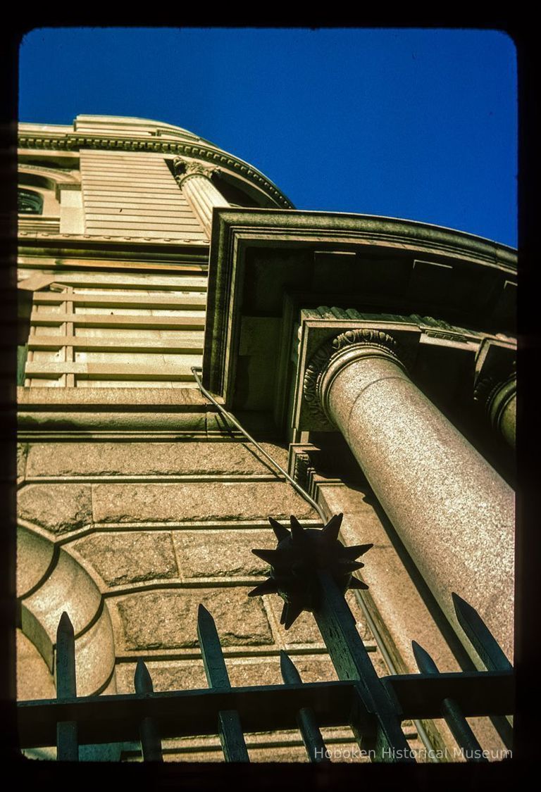 Color slide of detail view of metal railing, façade, cornice and pillar of the Hudson Trust Company building at 80 Hudson on the corner of Hudson and Newark picture number 1