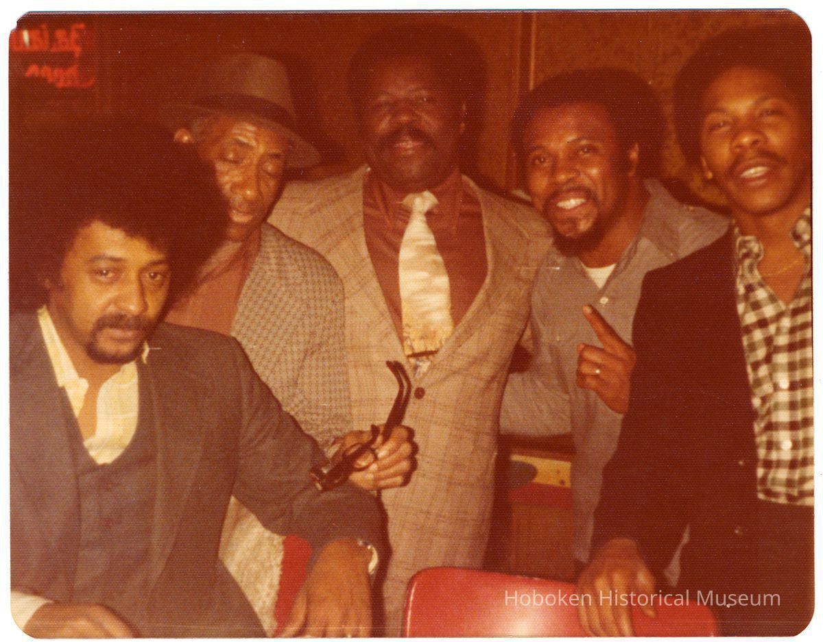 Digital copy of color photo of a group at the Zanzibar Club, Hoboken, no date, circa late 1960's - early 1970's. picture number 1