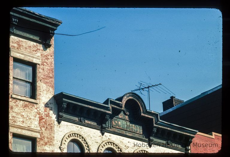 Color slide of close-up view of cornice, pediment and frieze reading 