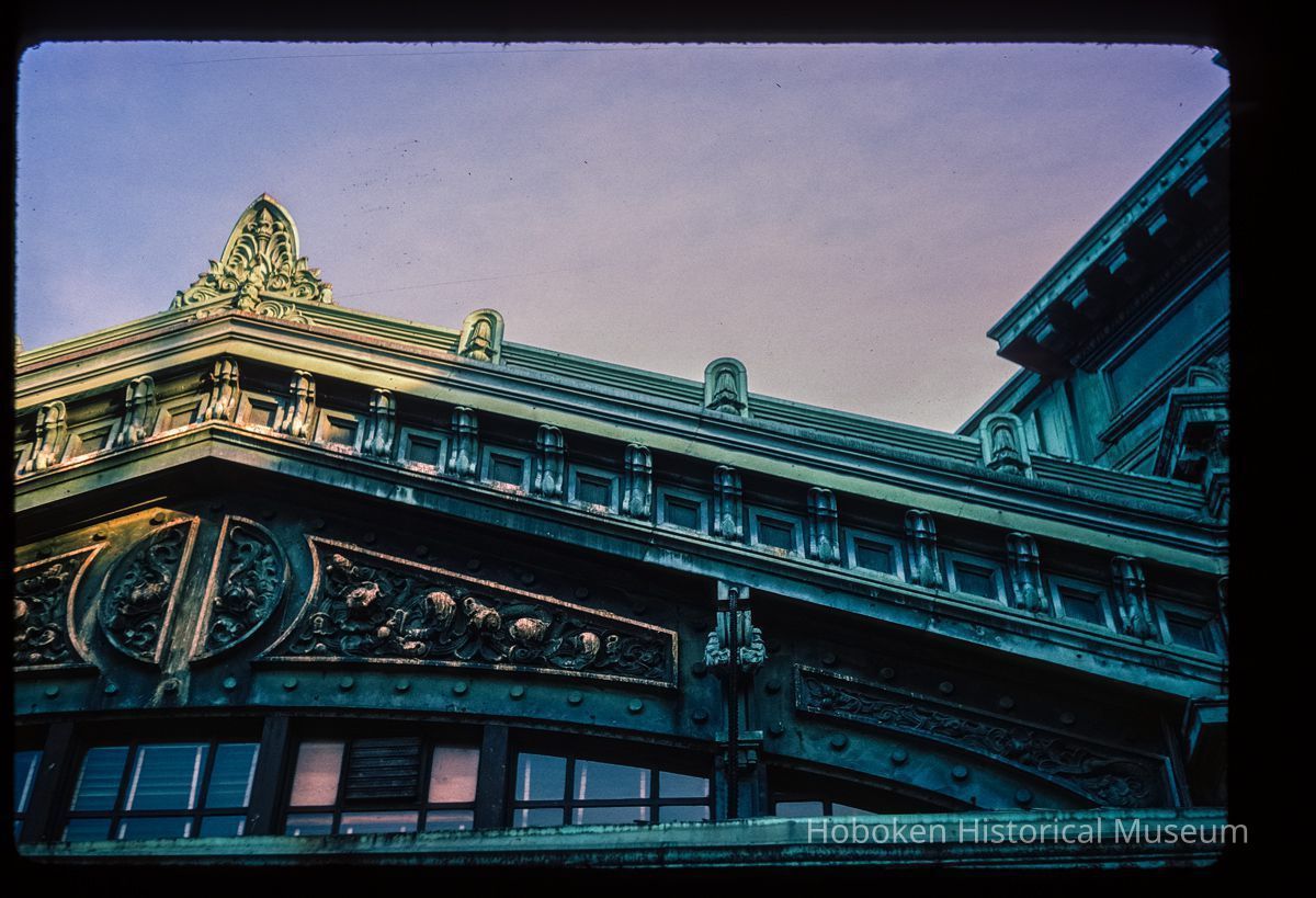 Color slide of detail view of the Lackawanna Terminal façade roofline showing finial, pediment, and cornice picture number 1
