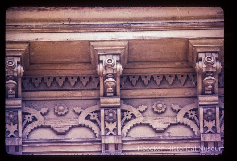 Color slide of detail view of cornice, brackets, and frieze on on a building between 1245 and 1253 Garden on the SE corner with 13th picture number 1