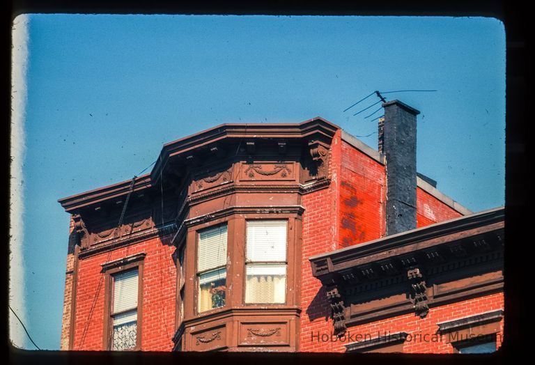 Color slide of detail view of cornice, dentils, brackets, frieze and bay windows at 221 and 223 Washington between 2nd and 3rd picture number 1