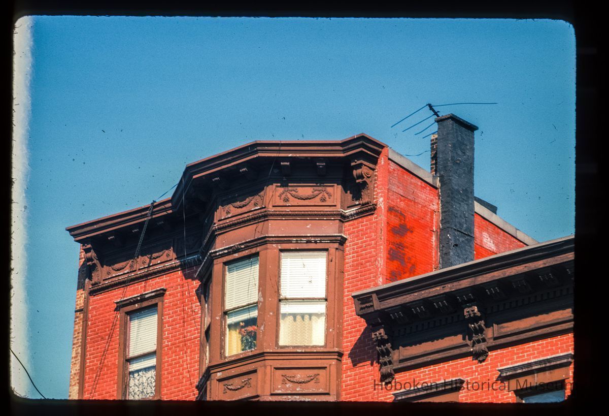 Color slide of detail view of cornice, dentils, brackets, frieze and bay windows at 221 and 223 Washington between 2nd and 3rd picture number 1