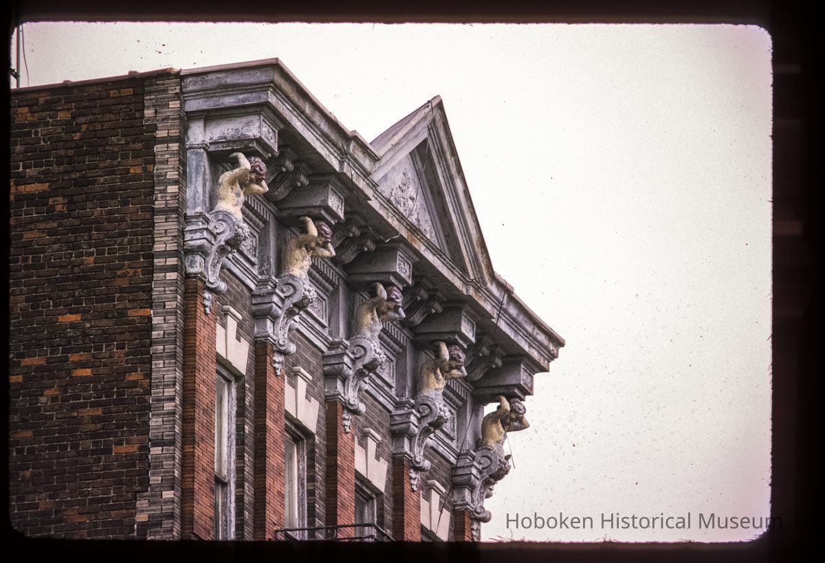 Color slide of close-up view of cornice, pediment, and figurine brackets at 712 Adams between 7th and 8th picture number 1