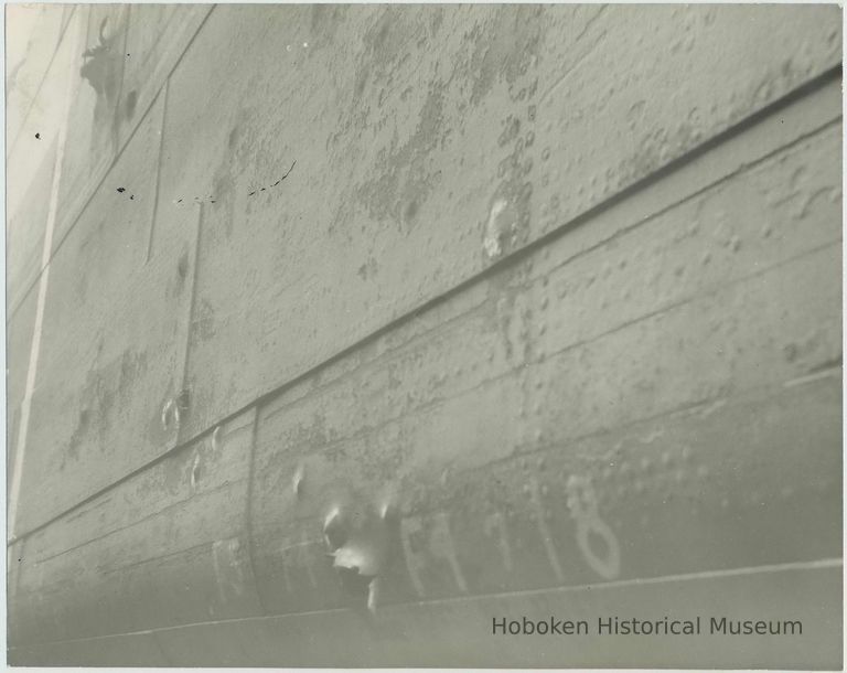 B+W photo of hull damage to an unidentified vessel at the Bethlehem Steel Shipyard, no date, ca. 1940. picture number 1