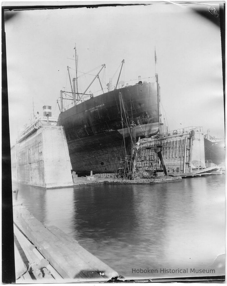 B+W photo of a bow view of the S.S. American Farmer in dry dock, steerage removed, Hoboken, no date, ca. 1940. picture number 1