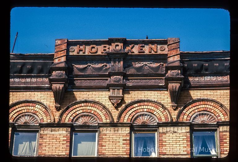 Color slide of close-up view of cornice, frieze reading 