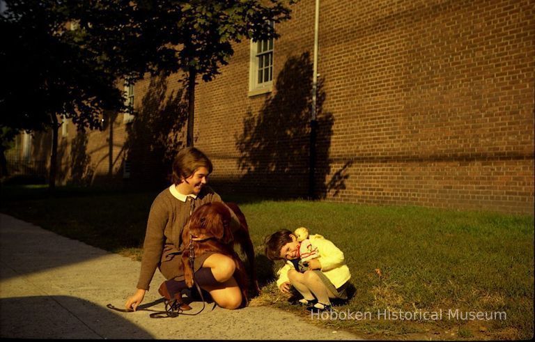 Color photo negative of Mary Ann Samperi Soule and young girl, Patricia Soule, on Hudson St. near Davidson Lab, Hoboken, no date, circa 1971. picture number 1