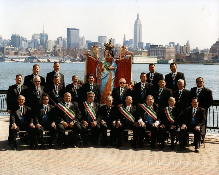 1: group posed at Hudson River waterfront with Madonna statue