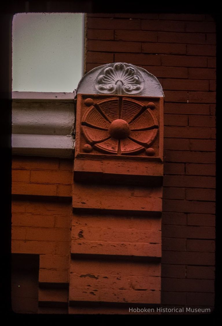 Color slide of detail view of brickwork, roundel and decorative tile at 1116 Garden between 11th and 12th picture number 1