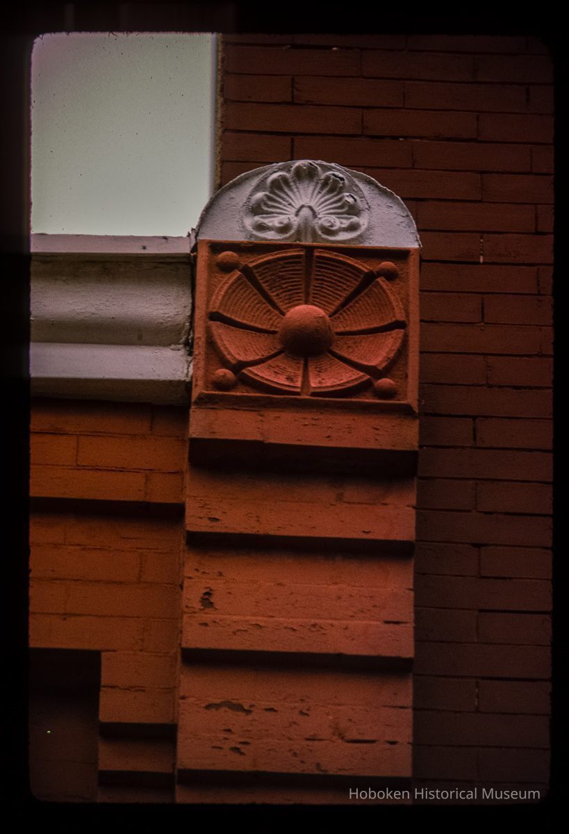 Color slide of detail view of brickwork, roundel and decorative tile at 1116 Garden between 11th and 12th picture number 1