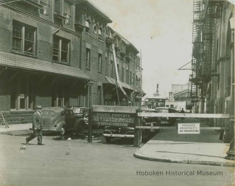 street between Hoboken Land Co. building & 77 River St., Hoboken, ca. 1945