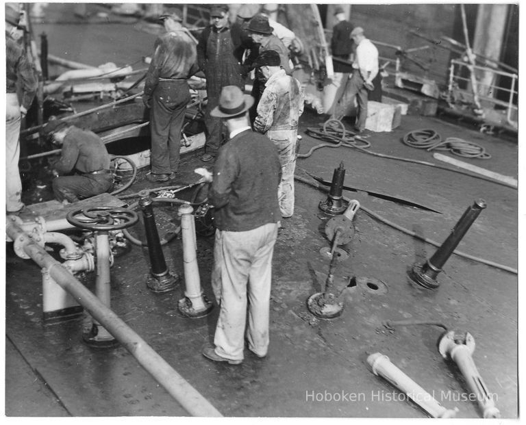 B+W photo of workers repairing main deck on unknown ship, Hoboken, no date, ca. 1940. picture number 1