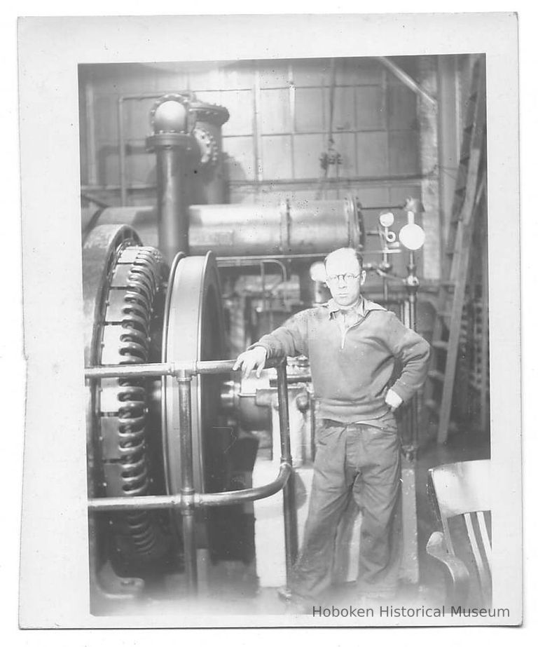 B+W photo of William Craig, photographer, inside a shipyard building, Hoboken, no date, ca 1935-1943. picture number 1