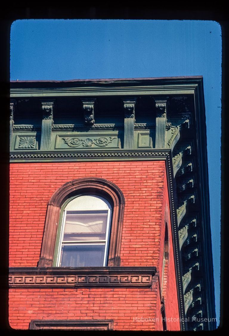 Color slide of detail view of cornice, brackets, frieze and arched window at 1201 Bloomfield on the NE corner with 12th picture number 1