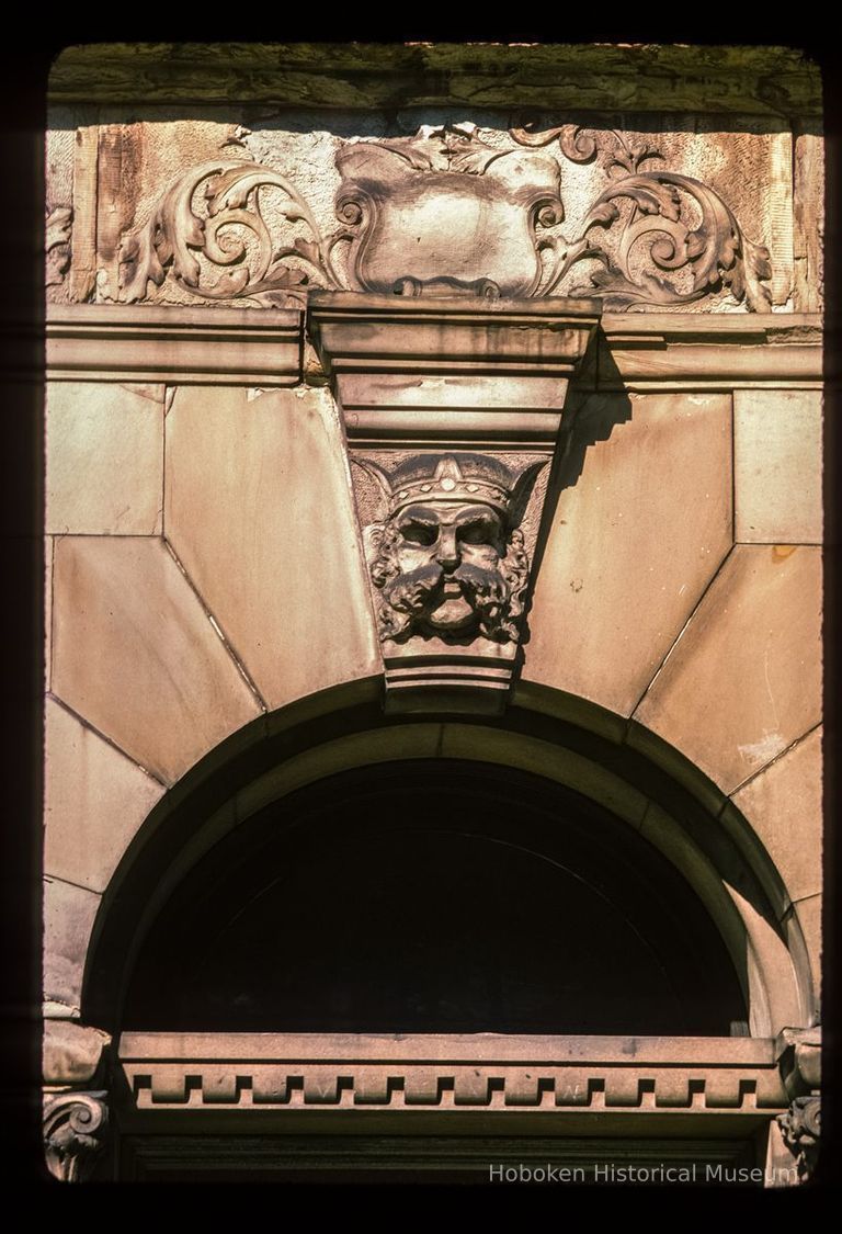 Color slide of close-up view of portico keystone, semicircular arch and transom window on one of the buildings between 1110 and 1120 Washington between 11th and 12th picture number 1