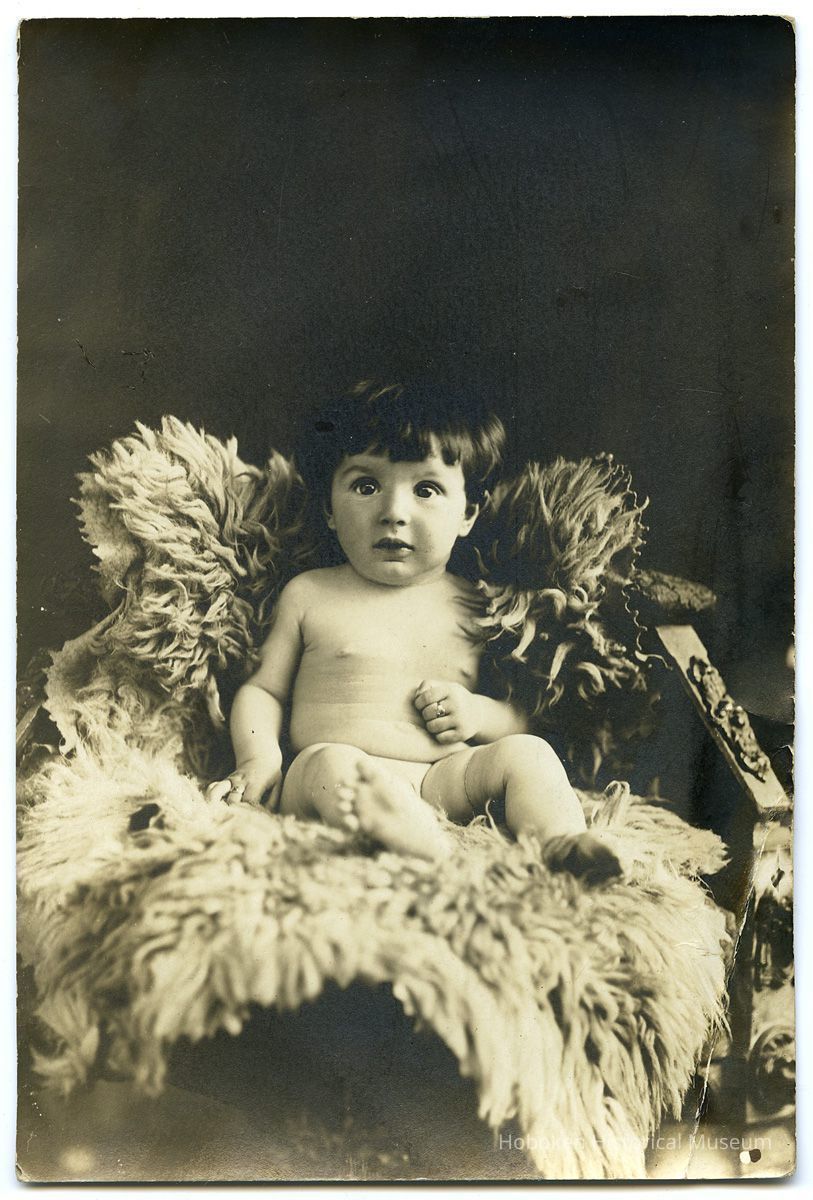image: baby, fur rug