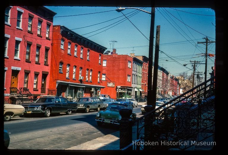 Color slide of eye-level view of row houses looking N on Garden from the SE corner with 7th picture number 1