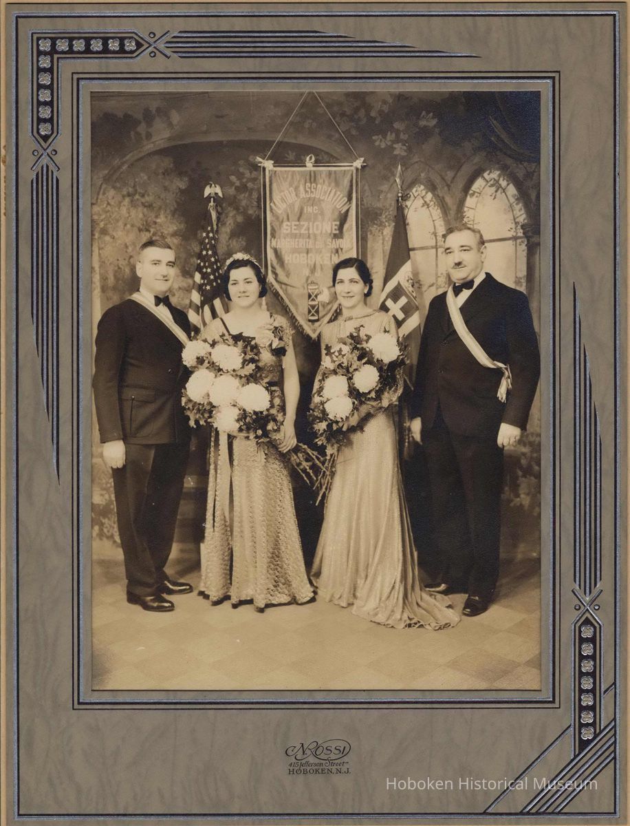 Sepia-tone studio group photo with Mildred Marion 