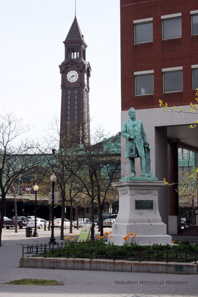 01 view of Sam Sloan Statue in relation to Hoboken Terminal