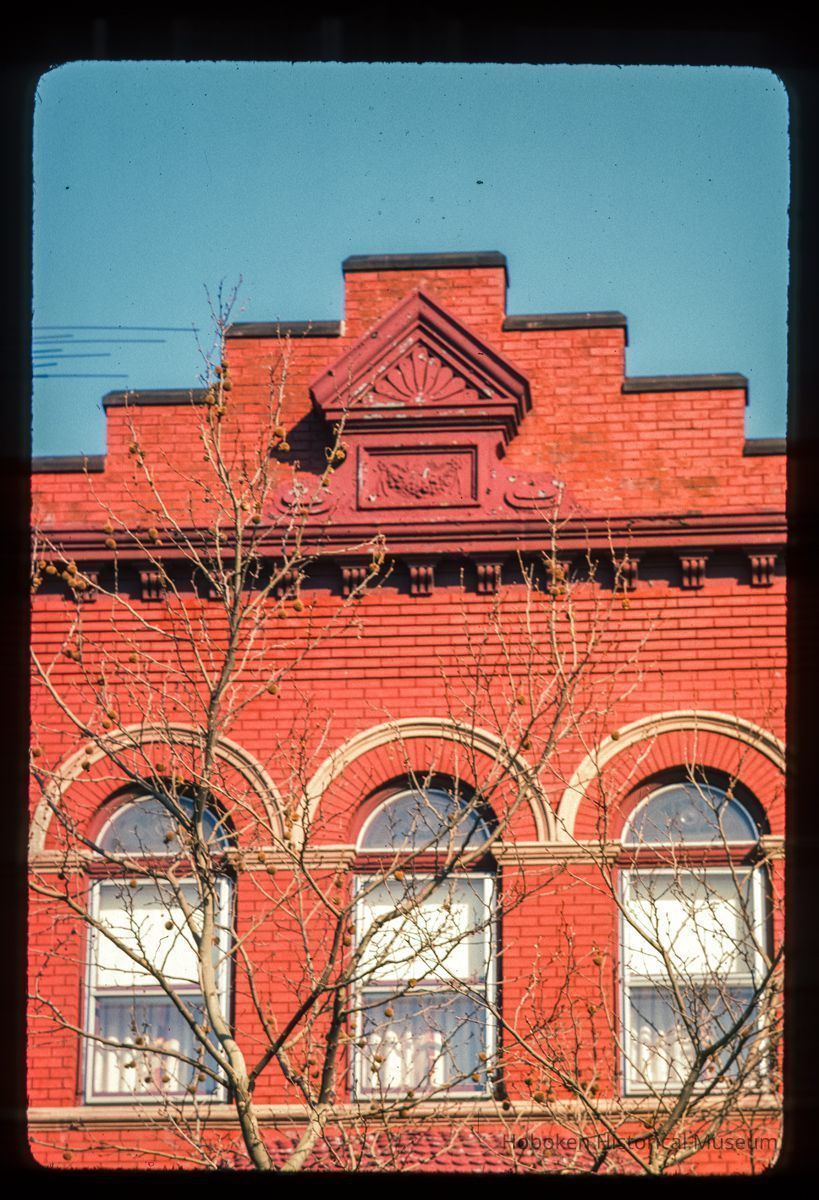 Color slide of close-up view of brick pediment, cornice, brackets and semicircular arches at 919 Washington between 9th and 10th picture number 1
