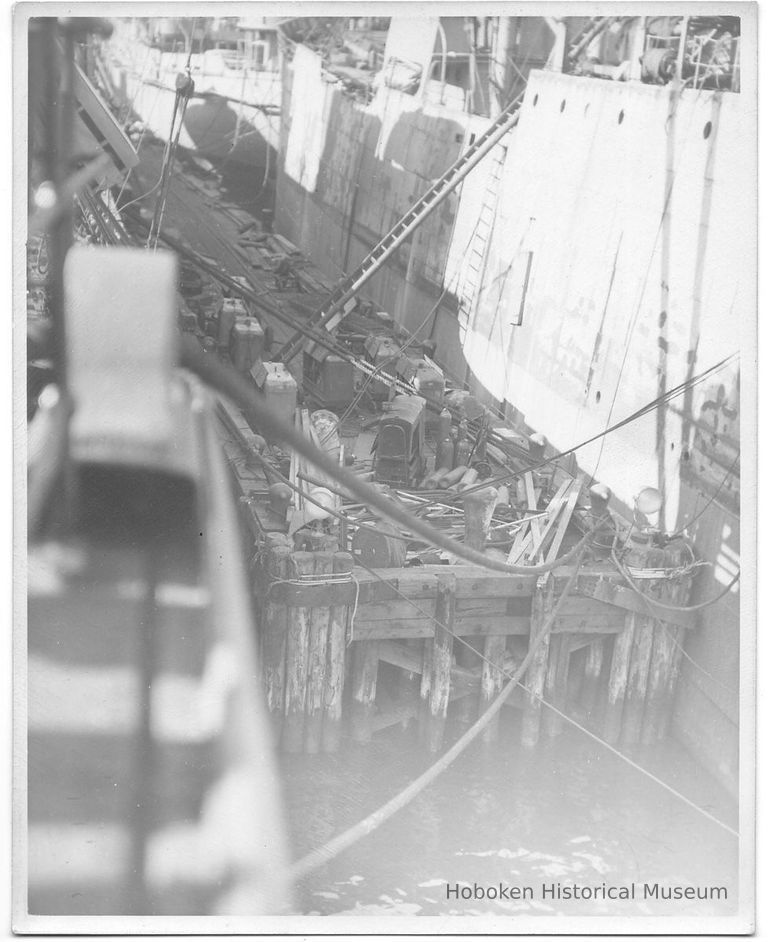 B+W photo of a of work pier; unknown ships in slip, Hoboken, no date, ca. 1940. picture number 1