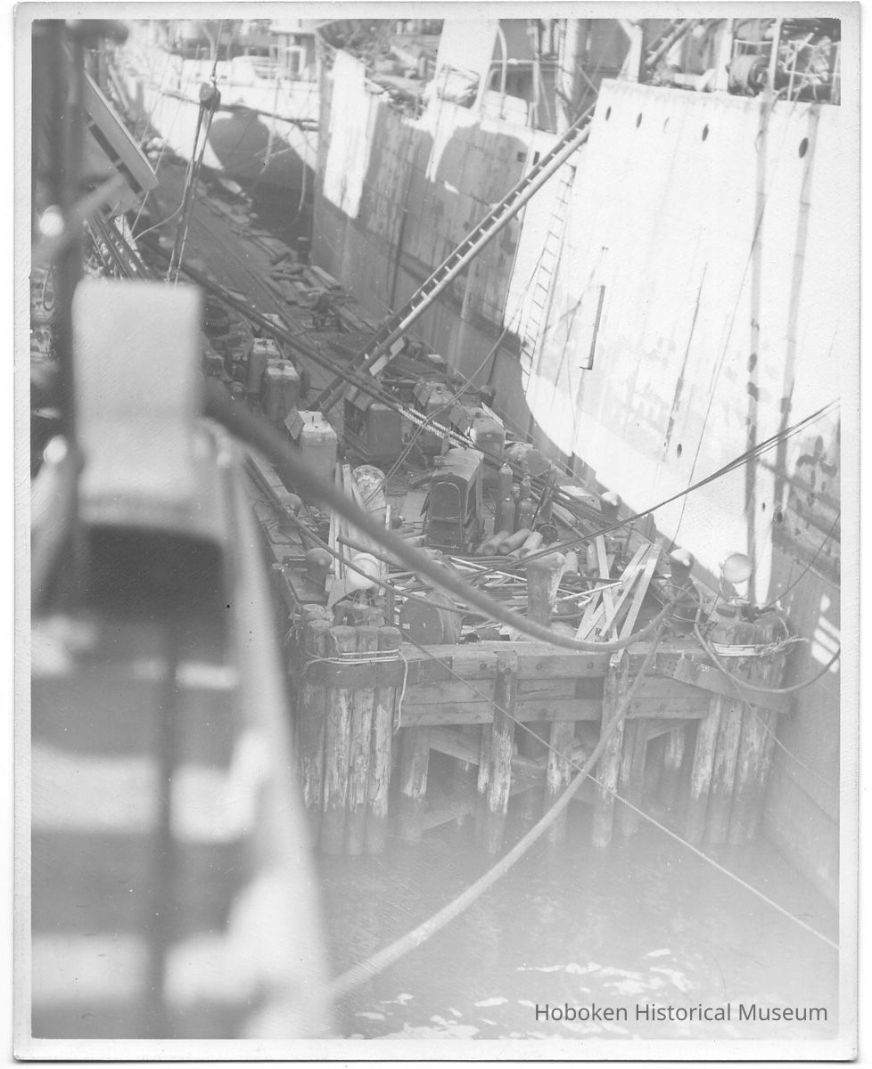 B+W photo of a of work pier; unknown ships in slip, Hoboken, no date, ca. 1940. picture number 1