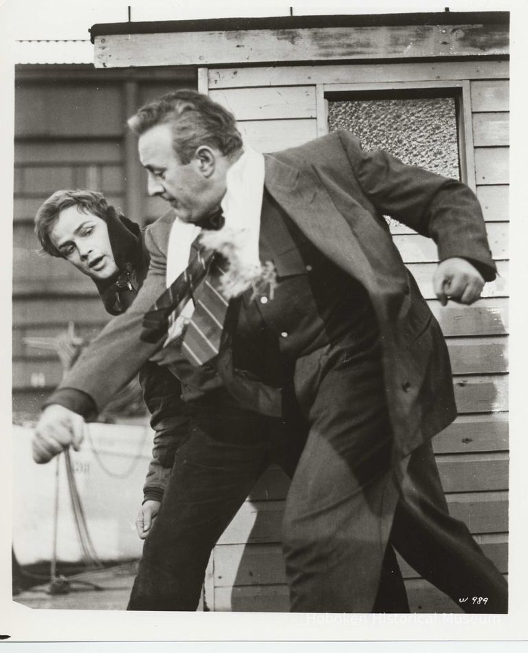 B+W publicity photo of Lee J. Cobb as Johnny Friendly and Marlon Brando as Terry Malloy in film 