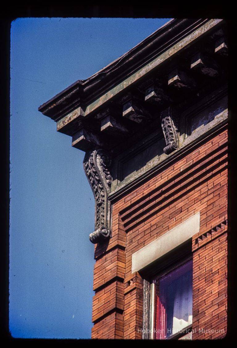 Color slide of detail view of cornice, brackets, dentils and brick quoins at 915 Garden between 9th and 10th picture number 1