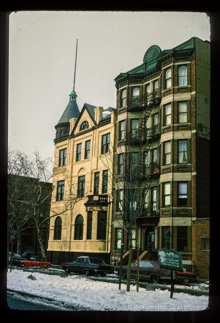 Color slide of eye-level view of side façade of the Columbia Club at 1101 Bloomfield and façade with fire escape at 106 11th on the NW corner of 11th and Bloomfield picture number 1