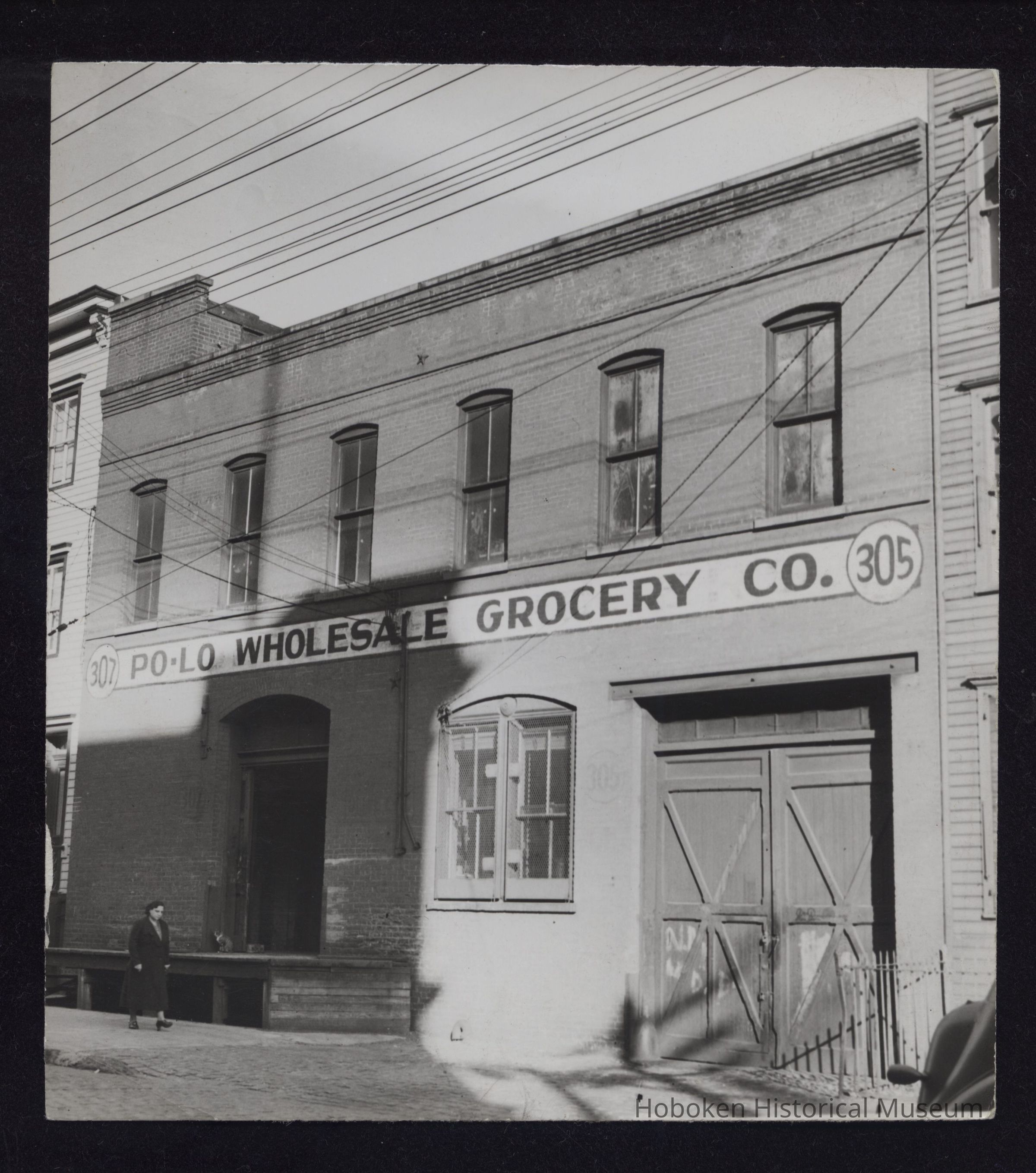B&W photo of commercial building at 305-307 Grand Street, Hoboken. picture number 1